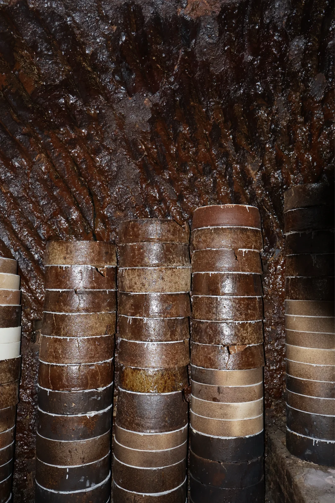 Stacks of ceramic firing containers inside a kiln