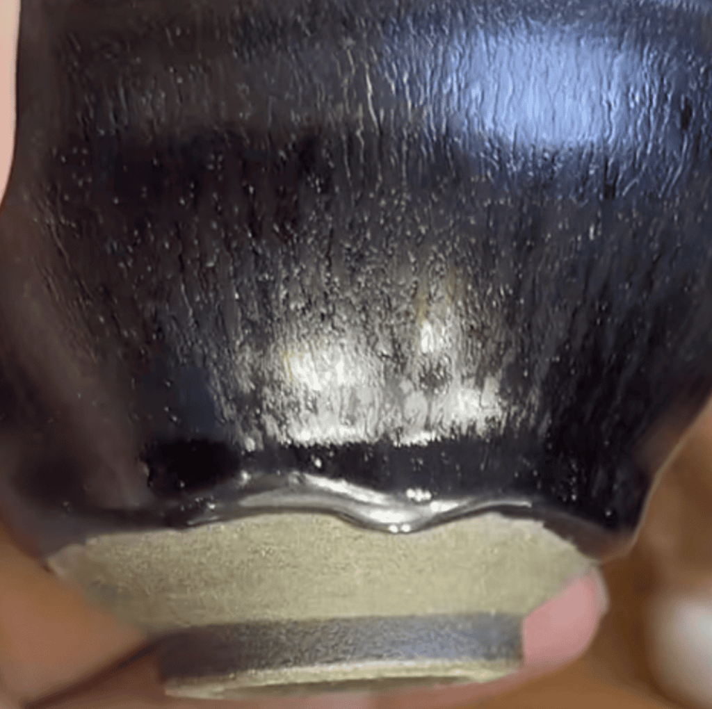 Pan Jiacai Jian ware showing dark iron-rich glaze and exposed clay body
