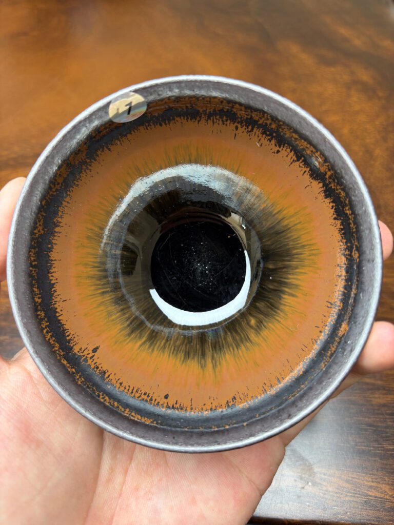 Jian ware bowl with amber copper-colored glaze and radiating streaks
