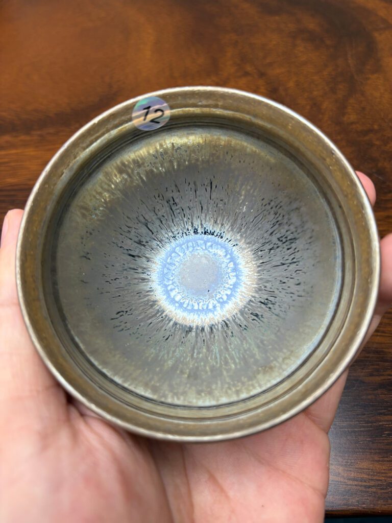 Jian ware bowl with silver-gray glaze and blue iridescent center